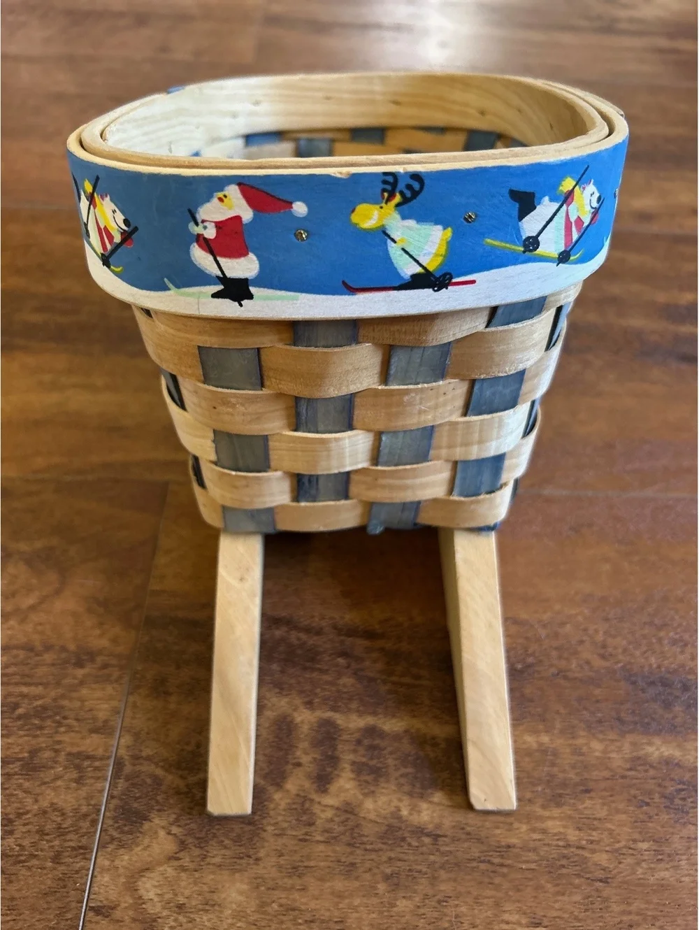 Handwoven Wooden Sled Basket with Festive Skiing Santa and Reindeer Trim